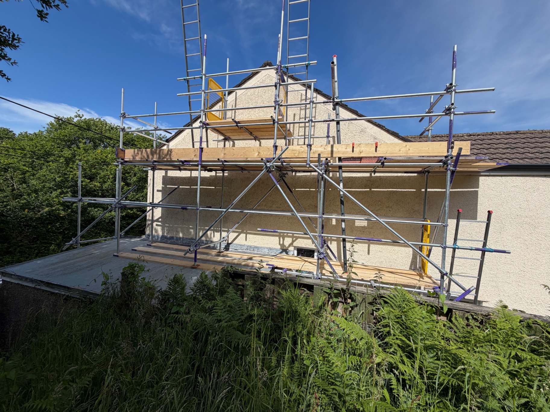 Two-lift gable end scaffolding for roof repair in South Wales by All Heights Wales Ltd.